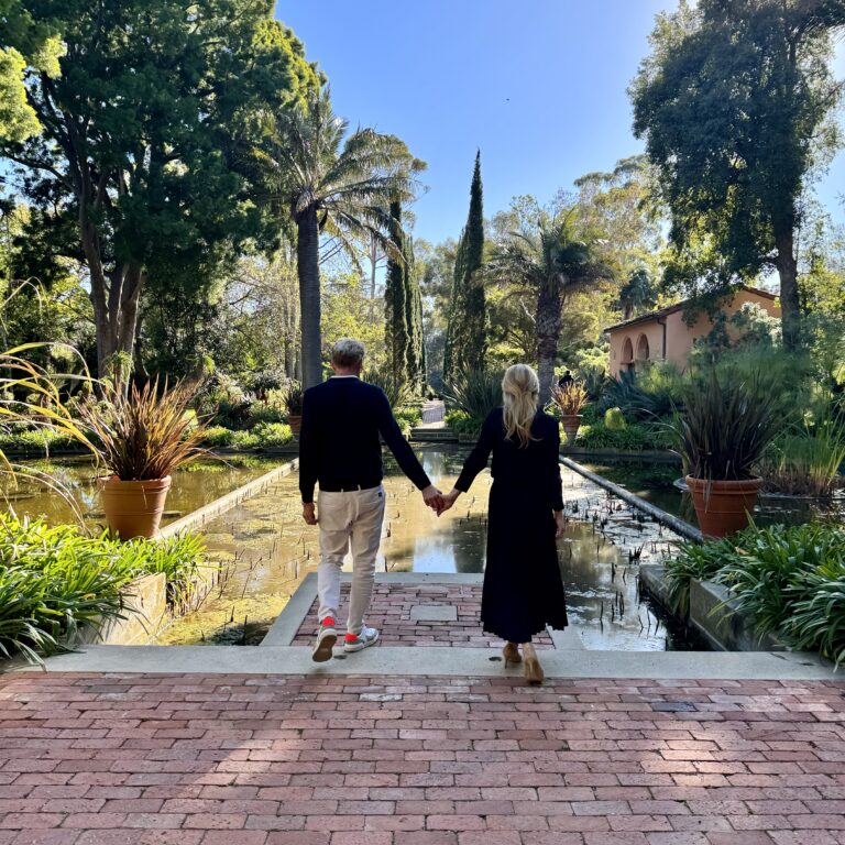 Couple holdings hands in the Water Garden.